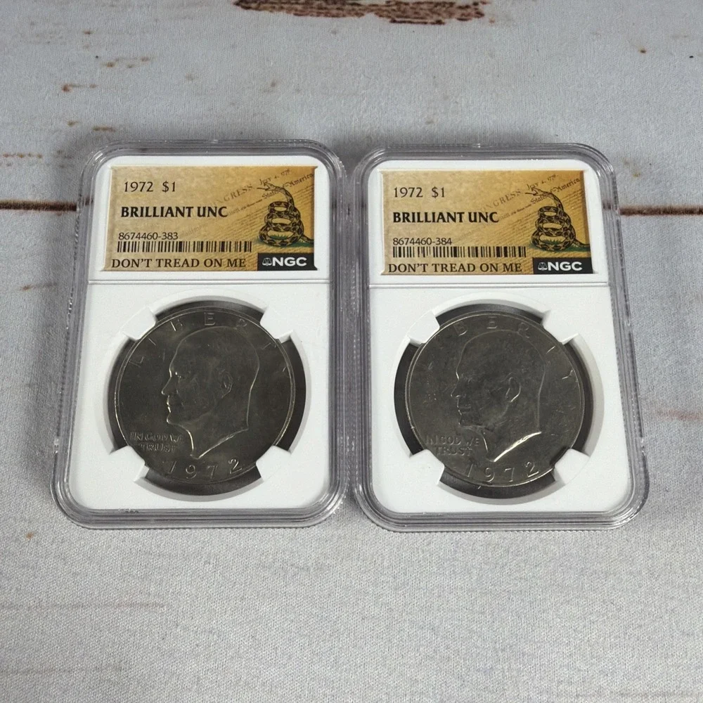 (2) 1972 Eisenhower Dollar Type 1 NGC Brilliant Uncirculated Gadsden Flag Slabs